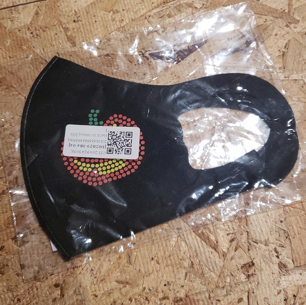 Black Face Mask with Pumpkin Design.